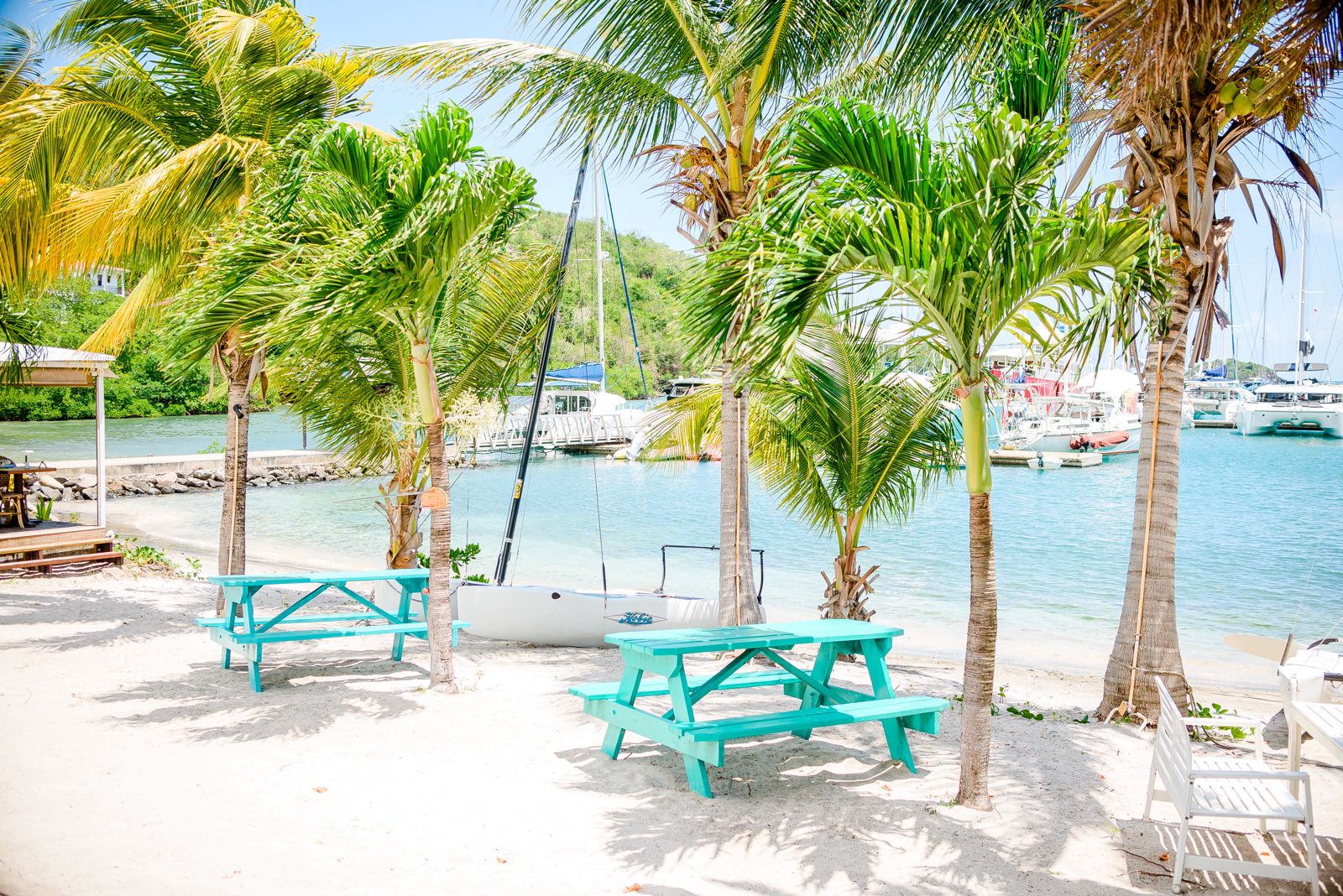 Beach dining area with turquoise tables