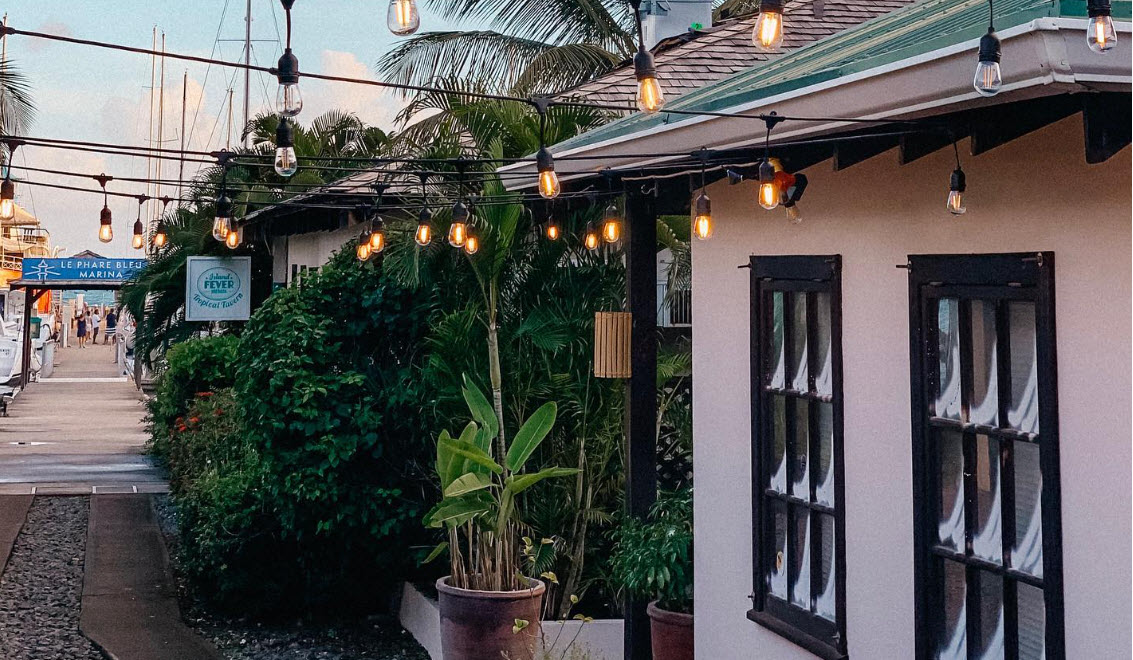 Le Phare Bleu mini market with evening string lights
